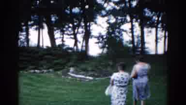 Illinois USA (1962): A Scene Of Two Women Walking In A Field Together
