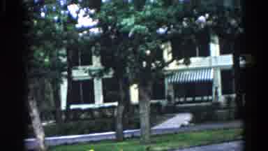 Illinois USA (1962): Trees And Driveway In Front Of White Building With Awning