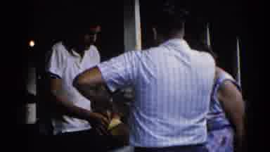Illinois USA (1962): Two Men And A Lady Standing Around Talking And 1 Of The Men