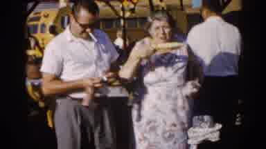 Illinois USA (1962): People At Fairground Having Fun Eating Smoking Playing With