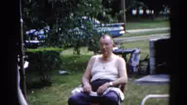 Illinois USA (1962): Old Man Sitting And Making Funny Faces