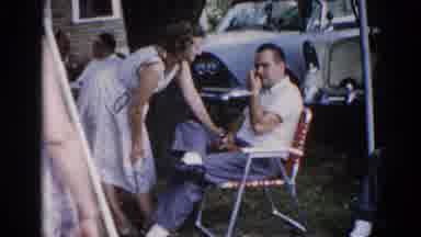 Illinois USA (1962): A Women Is Talking With A Men And The Old Peoples Also