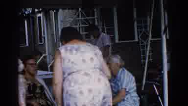 Illinois USA (1962): The Old Ladies Are Talking And Smiling Outside Of The House