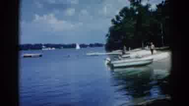 Illinois USA (1962): Men Prepare For Speedboat Ride On Beautiful Summer Day Amid