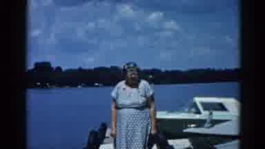 Illinois USA (1962): Lady On A Dock At A Lake Near Some Boats