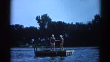 Illinois USA (1962): Two Girls Playing On A Pier Near The Waters Of A Lake