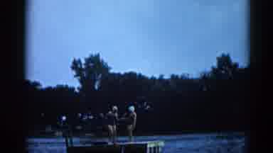 Illinois USA (1962): Two Women In Bathing Caps Happily Dancing On A Dock