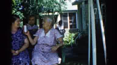 ILLINOIS USA-1962: Multigenerational Visit Includes Swing On An Old Fashioned