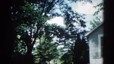 ILLINOIS USA-1962: Two Women Sit On Porch Swing In Shade