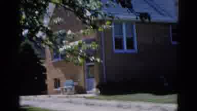 Illinois USA (1962): View Of Tan Brick Building With Two Women Sitting On Benches