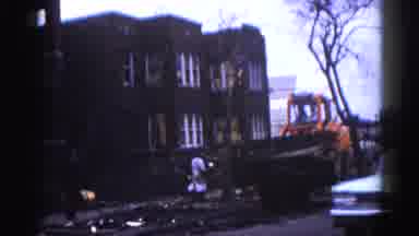 Illinois USA (1962): Residential Area Buildings Are Brick Workers Moving A Huge
