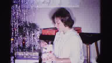 Hagerstown Maryland USA (1962): She Talks And Folds Clothes In Her House