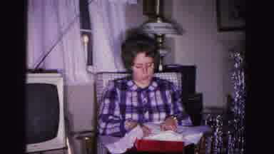 Hagerstown Maryland USA (1962): Girl Opens Christmas Gifts With The Family