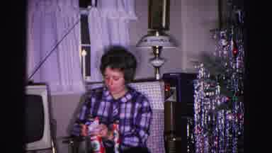 Hagerstown Maryland USA (1962): Woman Opens Gift Packaging In Her Living Room Next