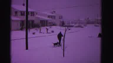 Hagerstown Maryland USA (1962): Person Running Down Snowy Sidewalk With His Dog