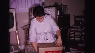 Hagerstown Maryland USA (1962): A Woman Opens Her Present In Her Birthday Party At
