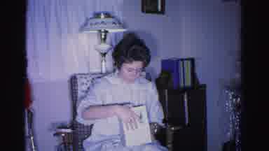 Hagerstown Maryland USA (1962): Woman Opens Gift Taken From Her Christmas Tree