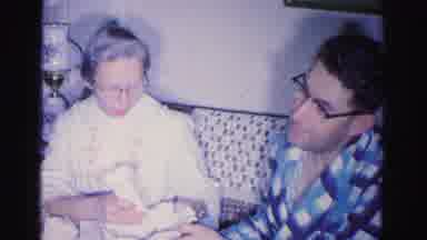 Hagerstown Maryland USA (1962): An Elder Woman Nurses An Infant Then A Younger
