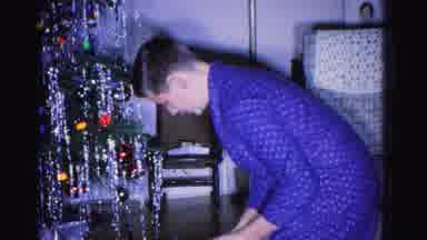 Hagerstown Maryland USA (1962): A Young Man Opening A Christmas Gift And An