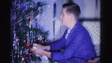 Hagerstown Maryland USA (1962): Man In Blue Robe Doing Something By Christmas Tree