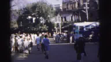 Calcutta India (1962): A Crowd Of People That Are Walking Around Parking Lot