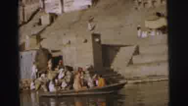 Calcutta India (1962): People Riding In Tan Rowboat On A Bright Sunny Day