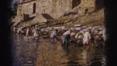 Calcutta India (1962): People Standing In A River Washing Their Clothes Next To