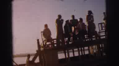 Calcutta India (1962): People Standing On A Dock And Washing Clothes In The River