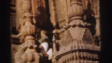 Calcutta India (1962): Brown And White Monkey Sitting On The Side Of A Large Stone