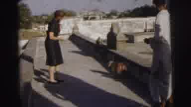 Calcutta India (1962): Woman Wearing Black Dress Shakes Hands With Baboon On A