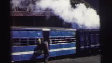 Calcutta India (1962): Steam Passenger Train Painted Blue Slowly Going By On