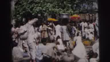 Calcutta India (1962): A Crowd Gathering Around A Big Pile Of Food In Broad