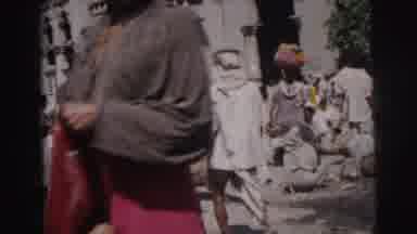 Calcutta India (1962): White Cow Standing In The Middle Of The Street With A Bunch