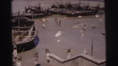 Calcutta India (1962): River Harbor Scene With People Carrying Items On Their