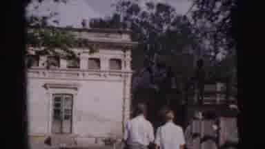 Calcutta India (1962): 3 Young People Two Males One Female Walk Towards An