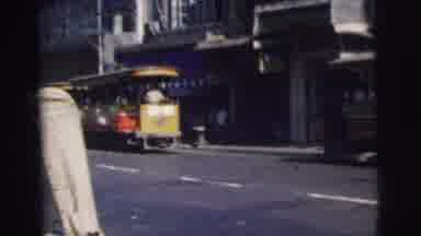 Calcutta India (1962): Vehicle Crossing With Citizens In Cars And People Boarding