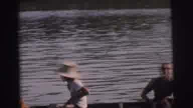 Calcutta India (1962): On A River Some People Sit In A Watercraft While Others Row