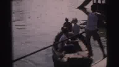 Calcutta India (1962): Man Prepares To Go On A River Boat Trip With Other Very
