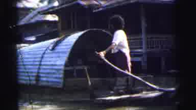 Calcutta India (1962): On A River Adults Stand At The Tiller Of A Vessel In The