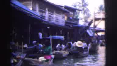 Calcutta India (1962): People In Gondolas On The River By An Elevated Walkway