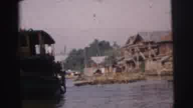 Calcutta India (1962): View Of Ferryboat And Wooden Huts On A Sunny Day
