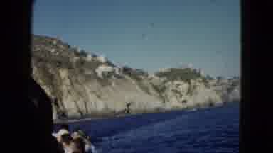 Acapulco Mexico (1962): A Boat On The Water With People Riding On It
