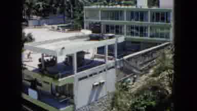 Acapulco Mexico (1962): A Large Building With A Patio And Windows Surrounded By