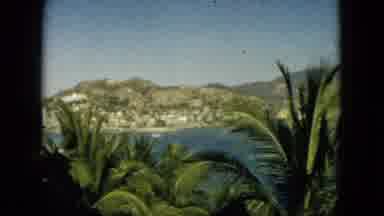 Acapulco Mexico (1962): Through A Window Vegetation Frames A Body Of Water And