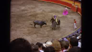 Acapulco Mexico (1962): A Cowboy On A Horse Engages In Bullfighting In An Arena