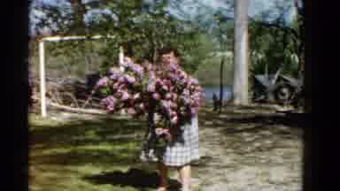 Wauconda Illinois USA (1961): The Lady Was Carrying Lots Of Flower In Her Hand And