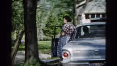 Wauconda Illinois USA (1961): Woman Leans On A White Car As Husband Sits Inside