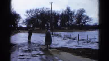 Wauconda Illinois USA (1961): Men Monitor The Rise In Water Levels After Heavy