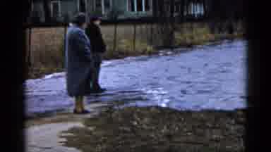 Wauconda Illinois USA (1961): Man And Woman Looking At Water Flooding Over A Road