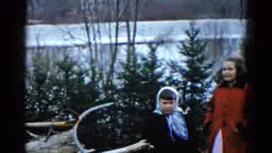 Wauconda Illinois USA (1961): Two Children Stand Together Outdoors And One Points